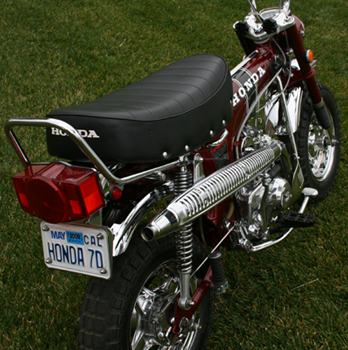 Honda 70 plate on maroon bike